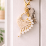 macrame keychain hanging on door with keys