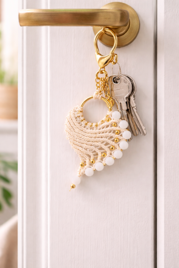 macrame keychain hanging on door with keys