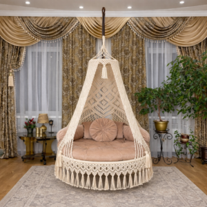 handmade indoor macrame hanging swing with cushion in luxury living room