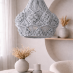 light blue macrame pendant light hanging in modern boho living room