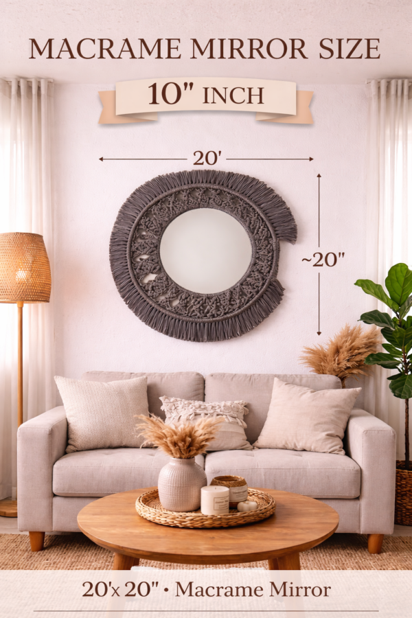 grey macrame wall mirror with fringe design styled above sofa in boho living room decor