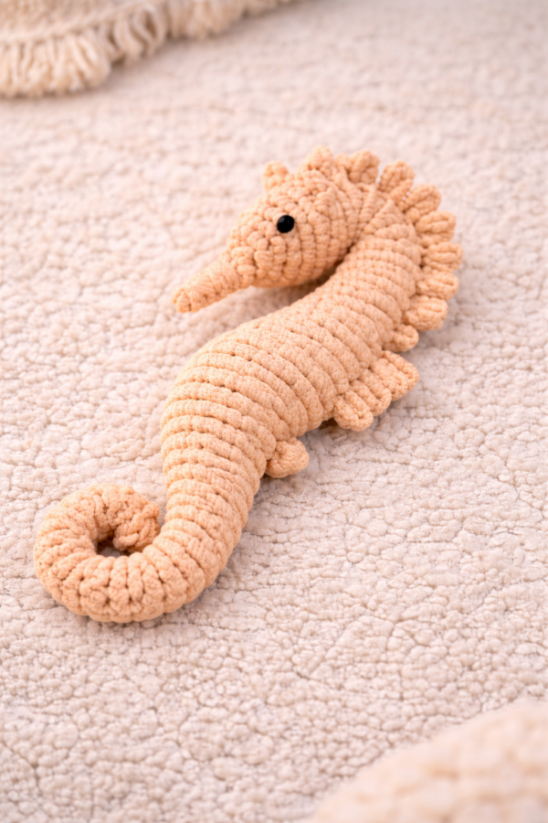 Handmade macrame seahorse toy in pastel yellow color