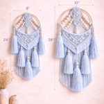 Handmade blue macrame dream catcher wall hanging with wooden beads and tassels in boho style home decor setting