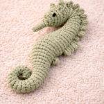Handmade macrame seahorse toy in pastel pgreen color