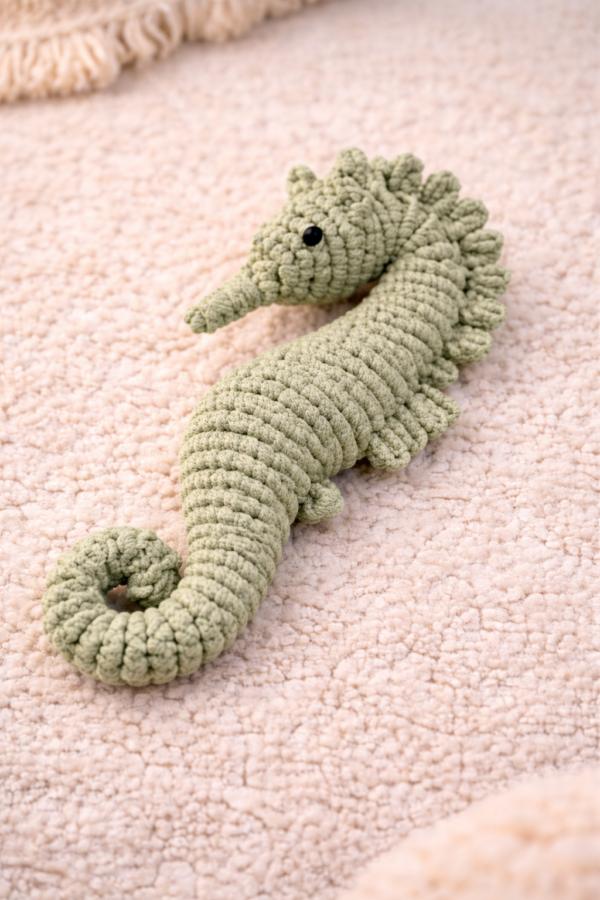 Handmade macrame seahorse toy in pastel pgreen color