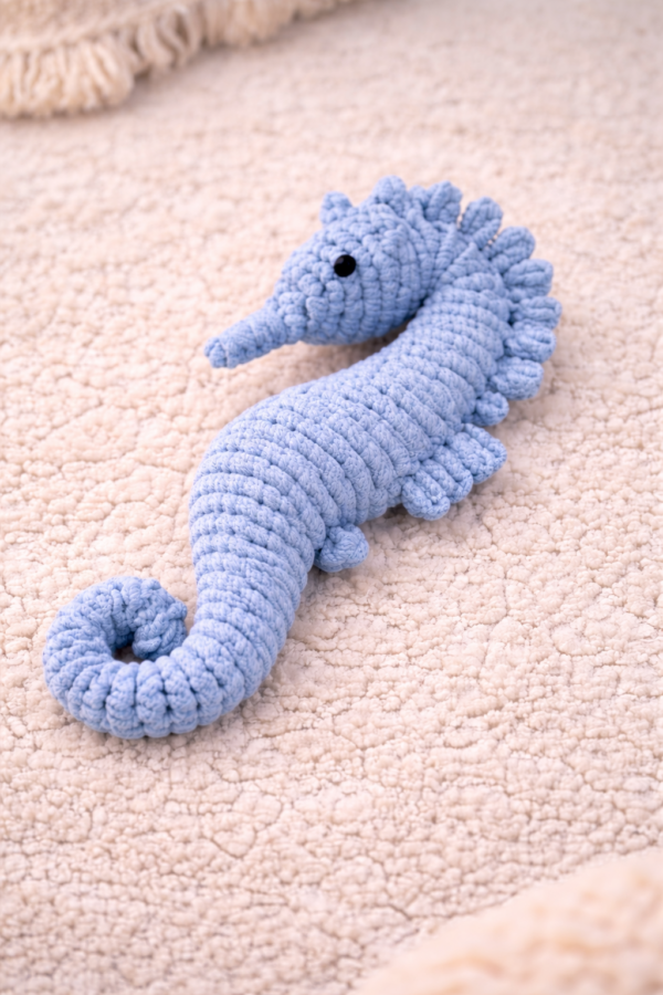 Handmade macrame seahorse toy in blue color