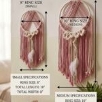 Handmade pink & beige macramé wall hanging with feather detail—perfect boho decor for cozy and aesthetic interiors.